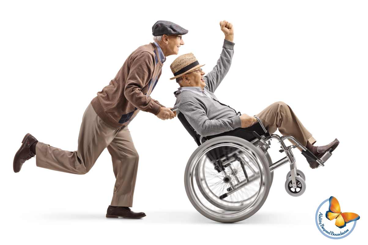 Senior man pushing a positive disabled man in a wheelchair gesturing with hand